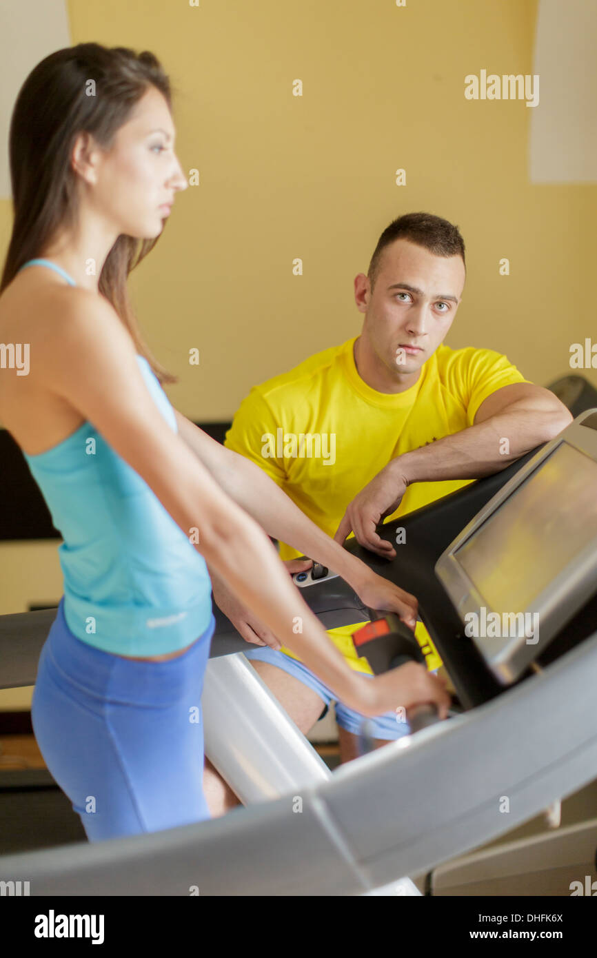 Young man and woman in the gym Stock Photo - Alamy