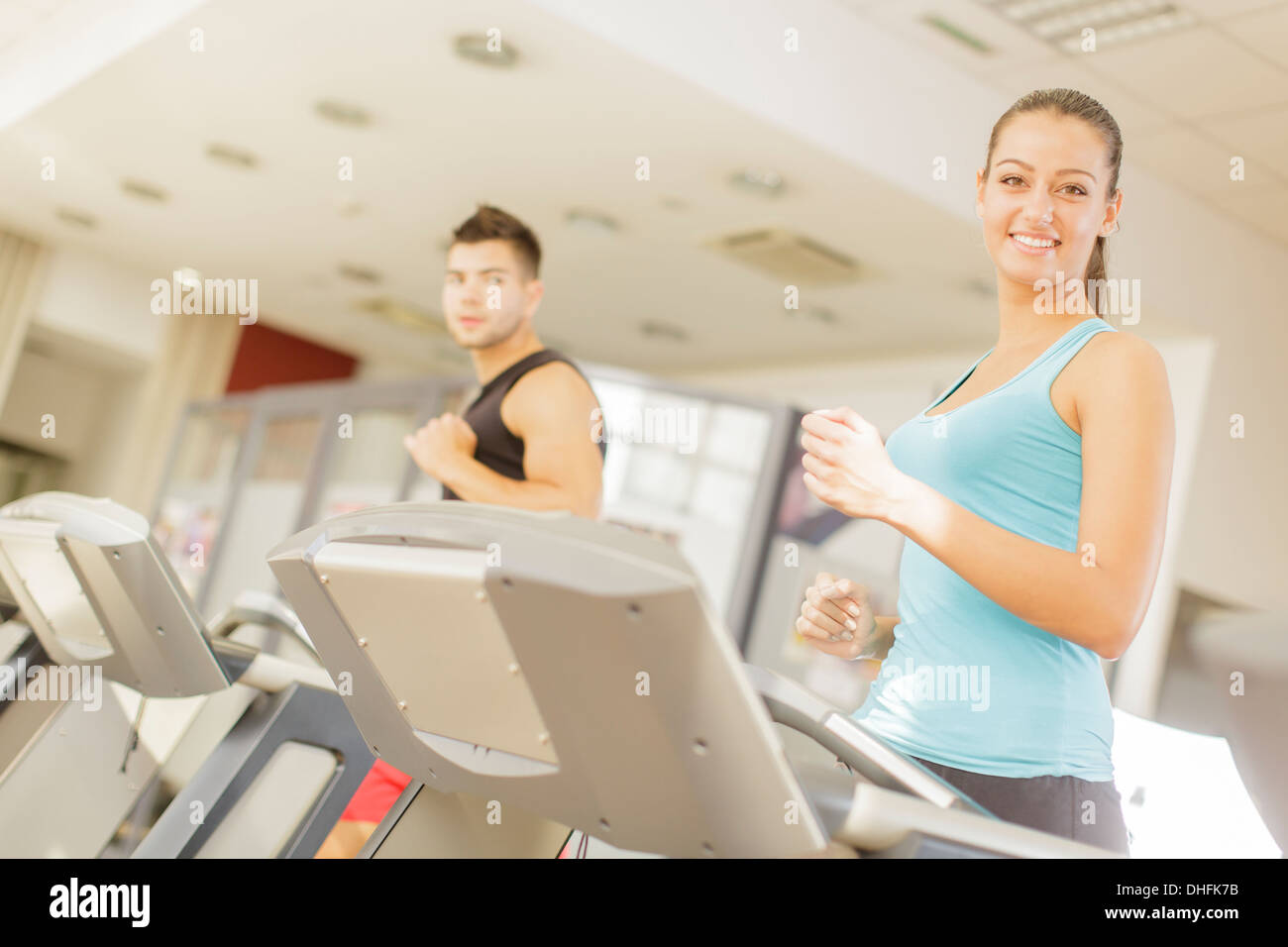 Young man and woman in the gym Stock Photo - Alamy