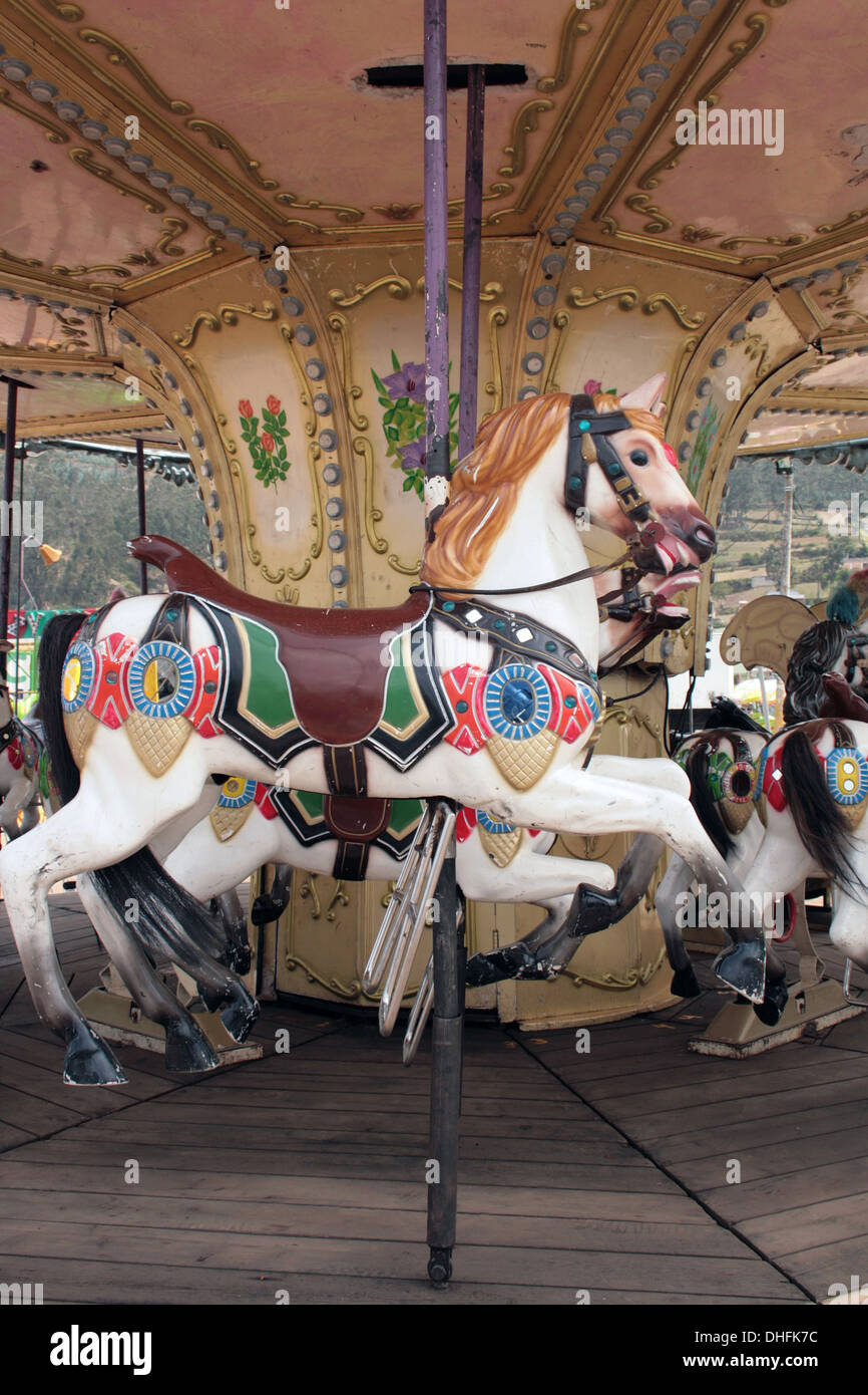 A colorful painted horse on a carousel in an amusement park in Otavalo, Ecuador Stock Photo