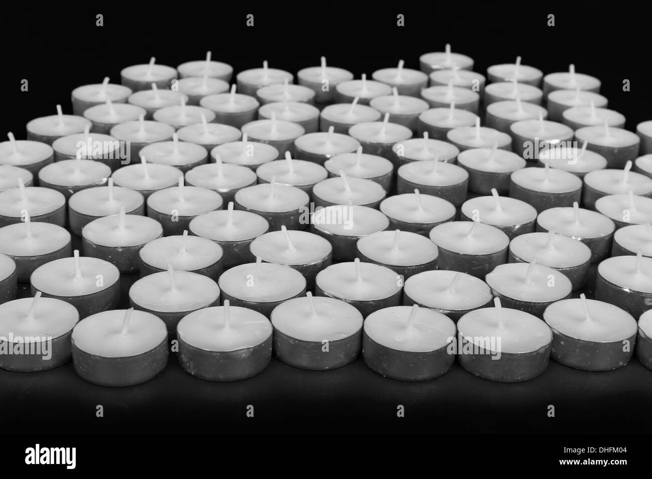 Group of white candles at a black background Stock Photo Alamy
