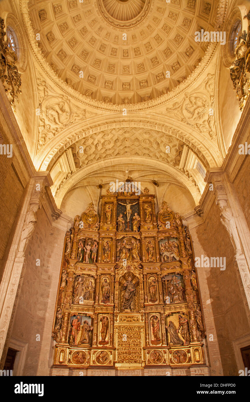 TOLEDO - MARCH 8: Polychrome main altar of San Roman church has a steeple built in the mudejar architectural style Stock Photo