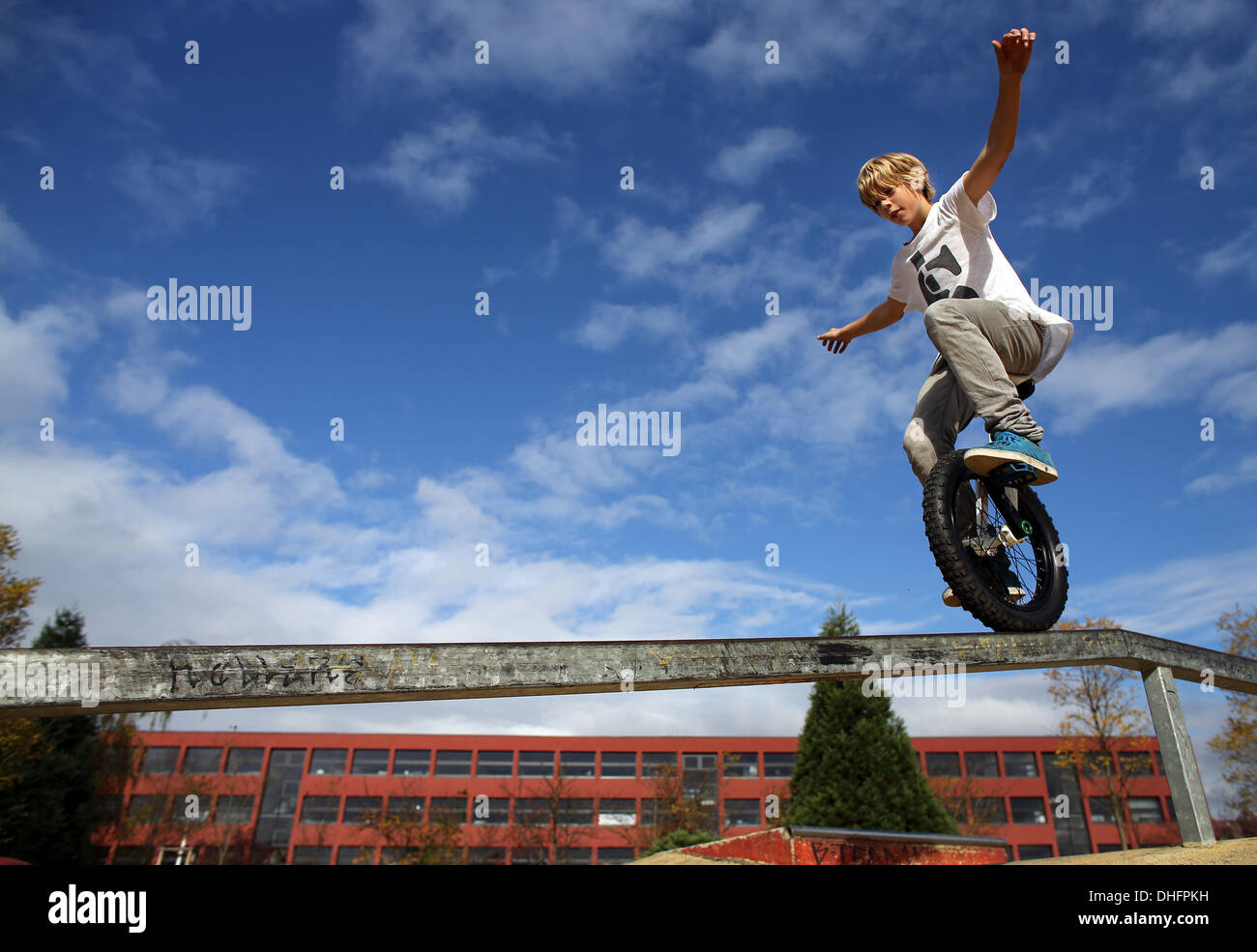 Leipzig, Germany. 24th Oct, 2013. 14 year old Mimo Valentin Seedler from  Leipzig drives on a bar with his unicycle across in Leipzig, Germany, 24  October 2013. Last year, Seedler, who took
