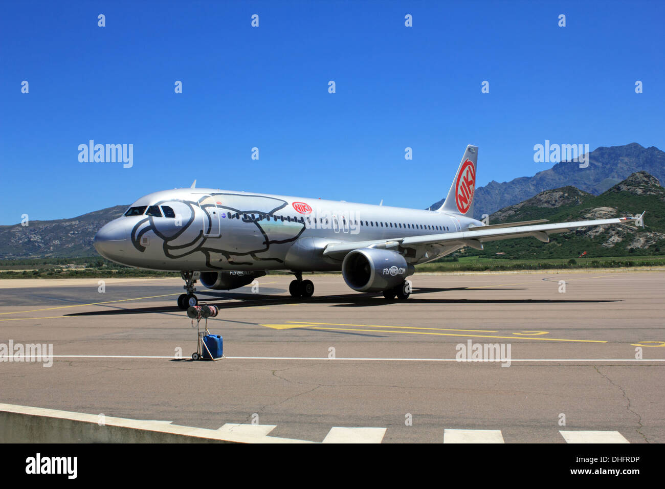 NIKI Luftfahrt GmbH, known as flyNiki plane on the runway at Calvi Airport  Corsica France Stock Photo - Alamy