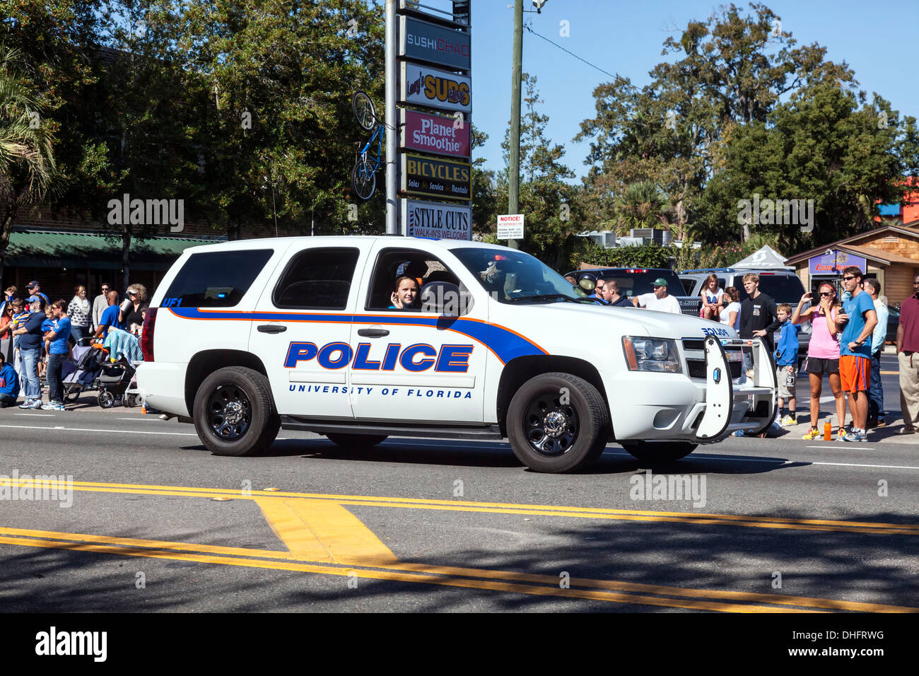 White UF Police SUV with orange and blue striping in the University of Florida 2013 Homecoming Parade. USA Stock Photo