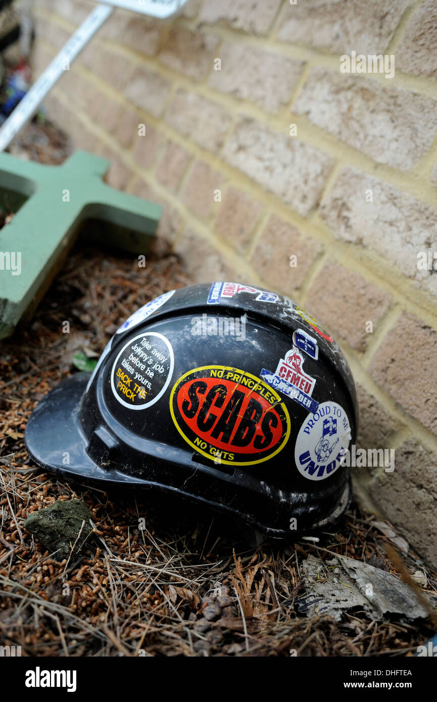 Construction worker's safety helmet covered in pro-Union stickers. Stock Photo