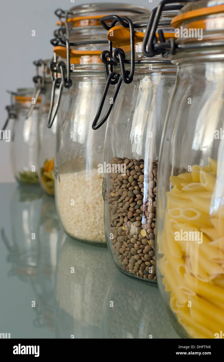 Glass storage jars filled with cookies in kitchen Stock Photo - Alamy