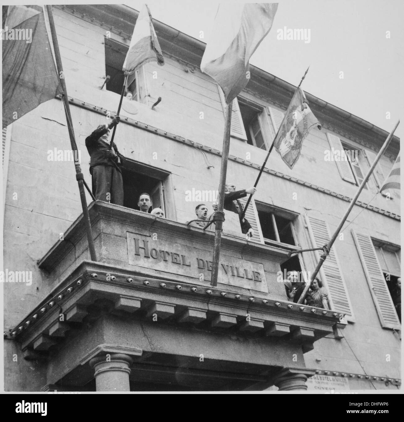 General Charles de Gaulle addresses the people of Cherbourg from the City Hall balcony, marking a key moment during his visit to France post-WWII. Stock Photo