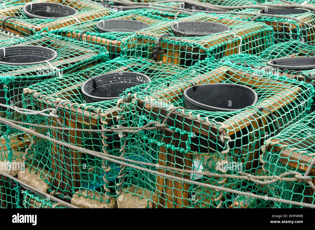 Several aligned fish traps in a fishing port in northern Spain Stock Photo