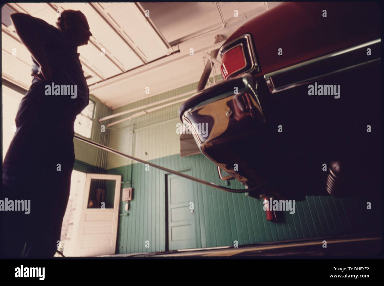 CAR BEING CHECKED AT AN AUTO EMISSION INSPECTION STATION IN NORWOOD, OHIO. THE TEST INCLUDES A