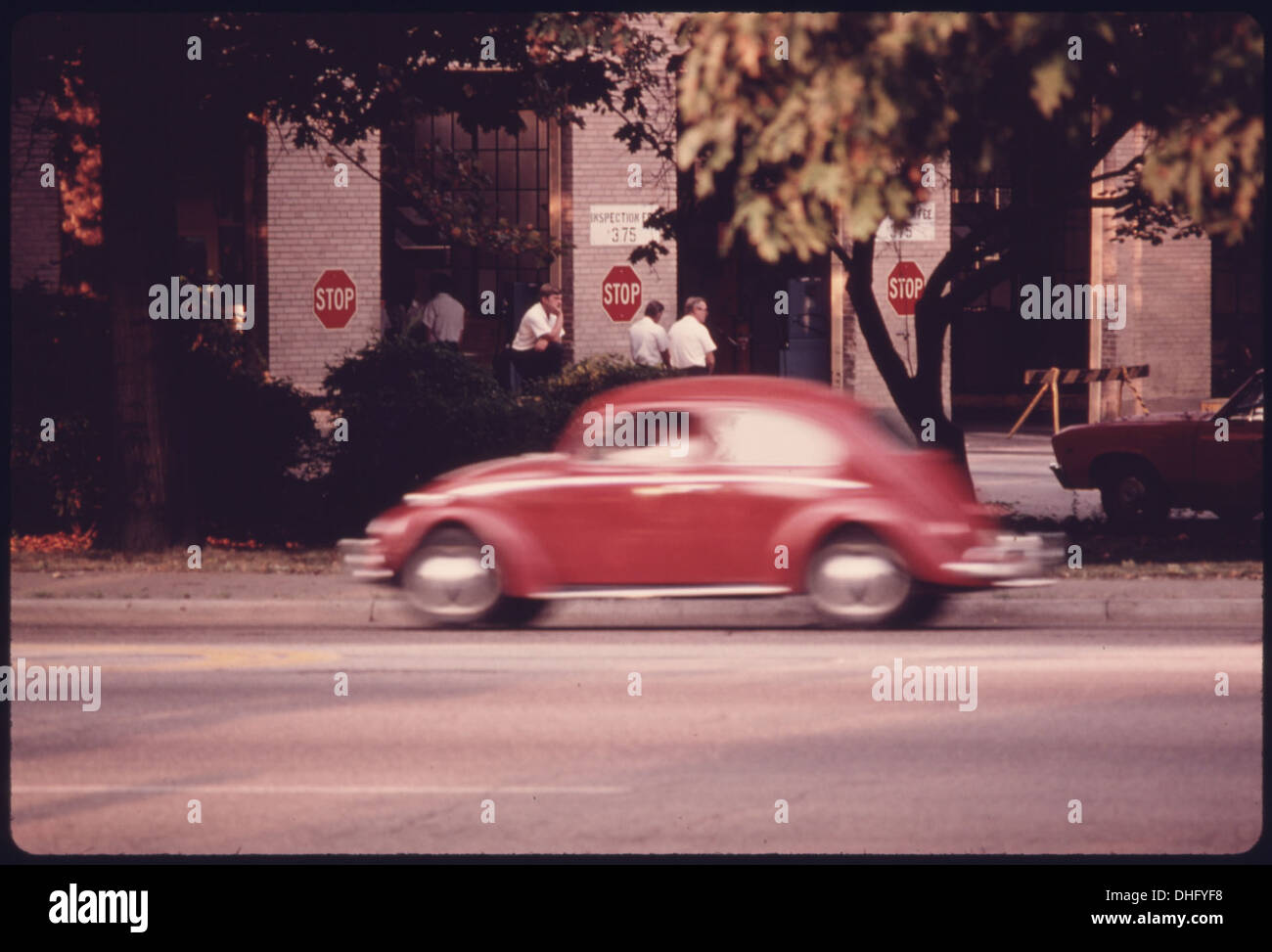 EMPLOYEES OF AN AUTO EMISSION INSPECTION STATION IN DOWNTOWN CINCINNATI, OHIO, WAIT FOR BUSINESS