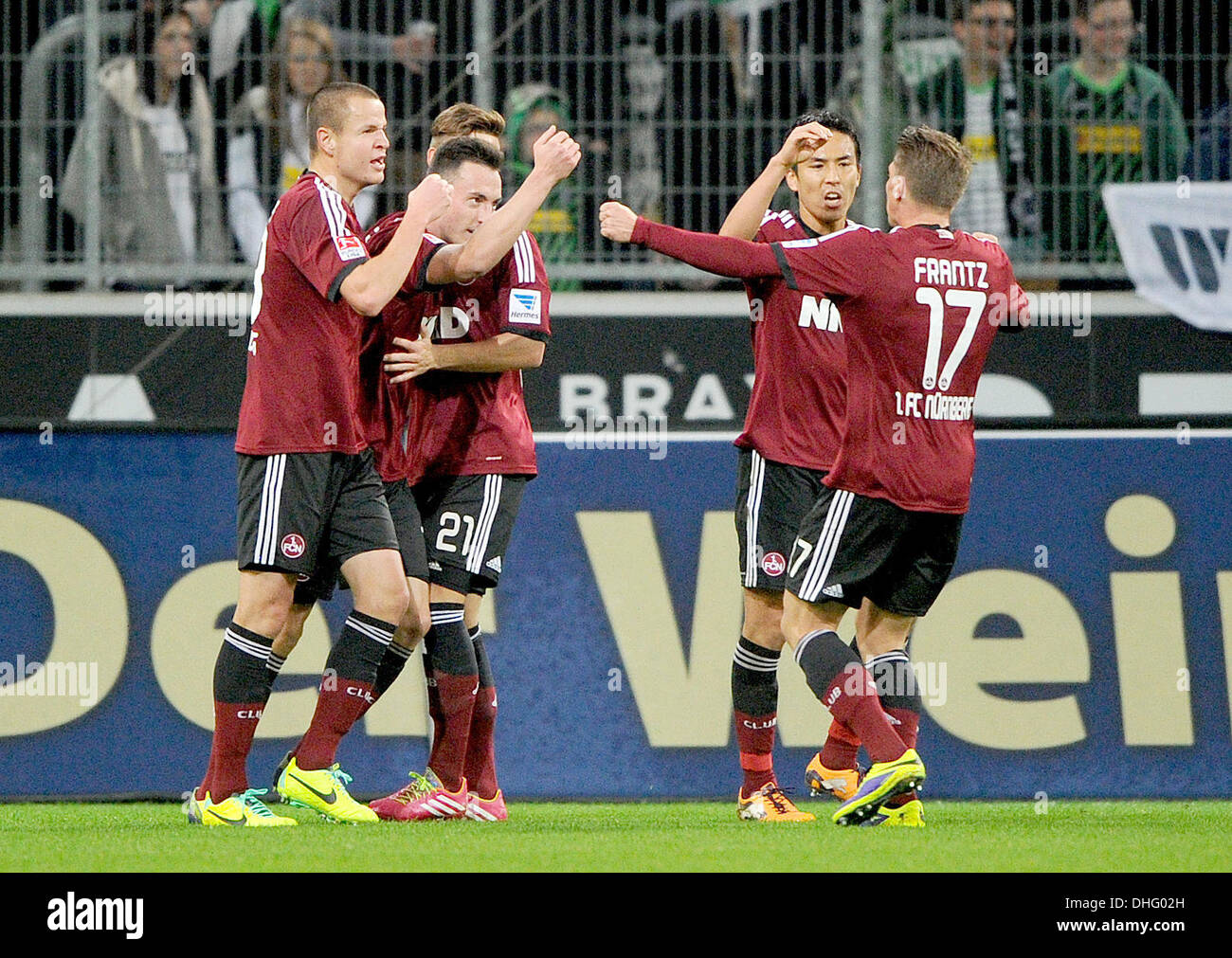 Moenchengladbach, Germany. 09th Nov, 2013. Nuremberg's Adam Hlousek (L-R), Josip Drmic, Marvin Plattenhardt, Hiroshi Kiyotake and Mike Frantz cheer Drmics 0-1 goal during the soccer Bundesliga match Borussia Moenchengladbach vs 1st FC Nuremberg in the Borussia-Park in Moenchengladbach, Germany, 09 November 2013. Photo: Jonas Guettler/dpa (ATTENTION: Due to the accreditation guidelines, the DFL only permits the publication and utilisation of up to 15 pictures per match on the internet and in online media during the match.)/dpa/Alamy Live News Stock Photo