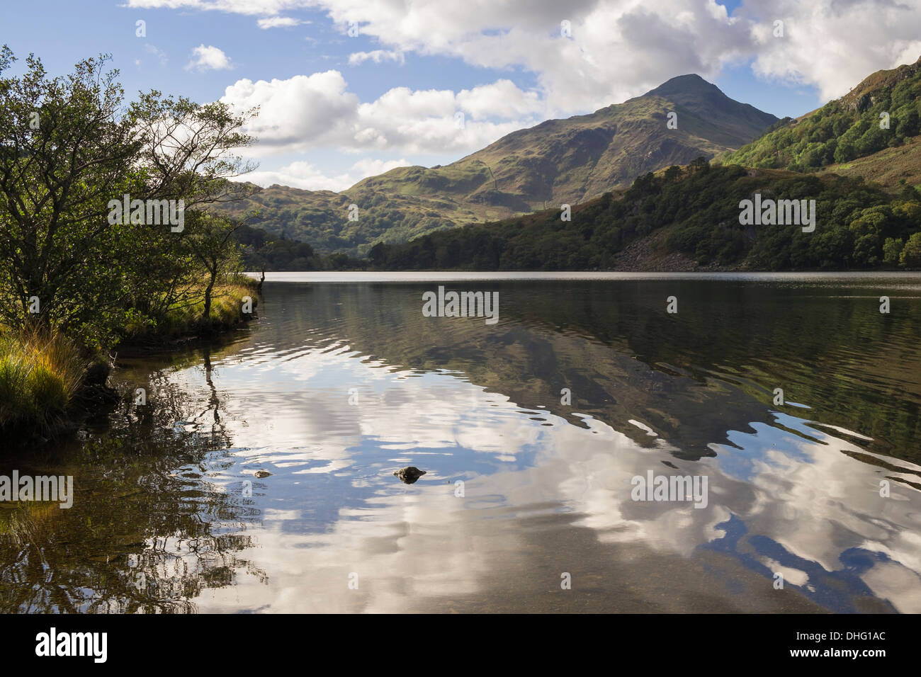 Yr Aran mountain reflected in rippled waters of Llyn Gwynant lake in mountains of Snowdonia, Nant Gwynant, North Wales, UK Stock Photo