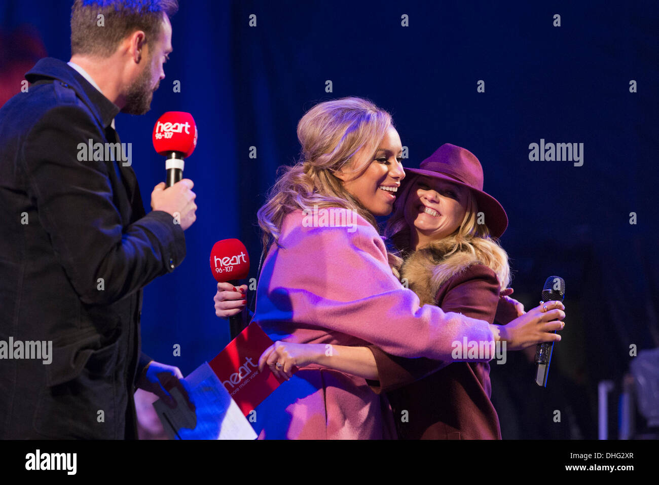 London, UK. 9 November 2013. X-Factor winner Leona Lewis on stage during the concert before the switch-on with Jamie Theakston, left, and Emma Bunton, right. It took the celebrities three attempts on stage until the Regent Street Christmas Lights were finally switched on due to a technical problem. The thousands who had gathered in Regent Street waited patiently and danced to Christmas songs whilst the problem was fixed. Photo: Nick Savage/Alamy Live News Stock Photo