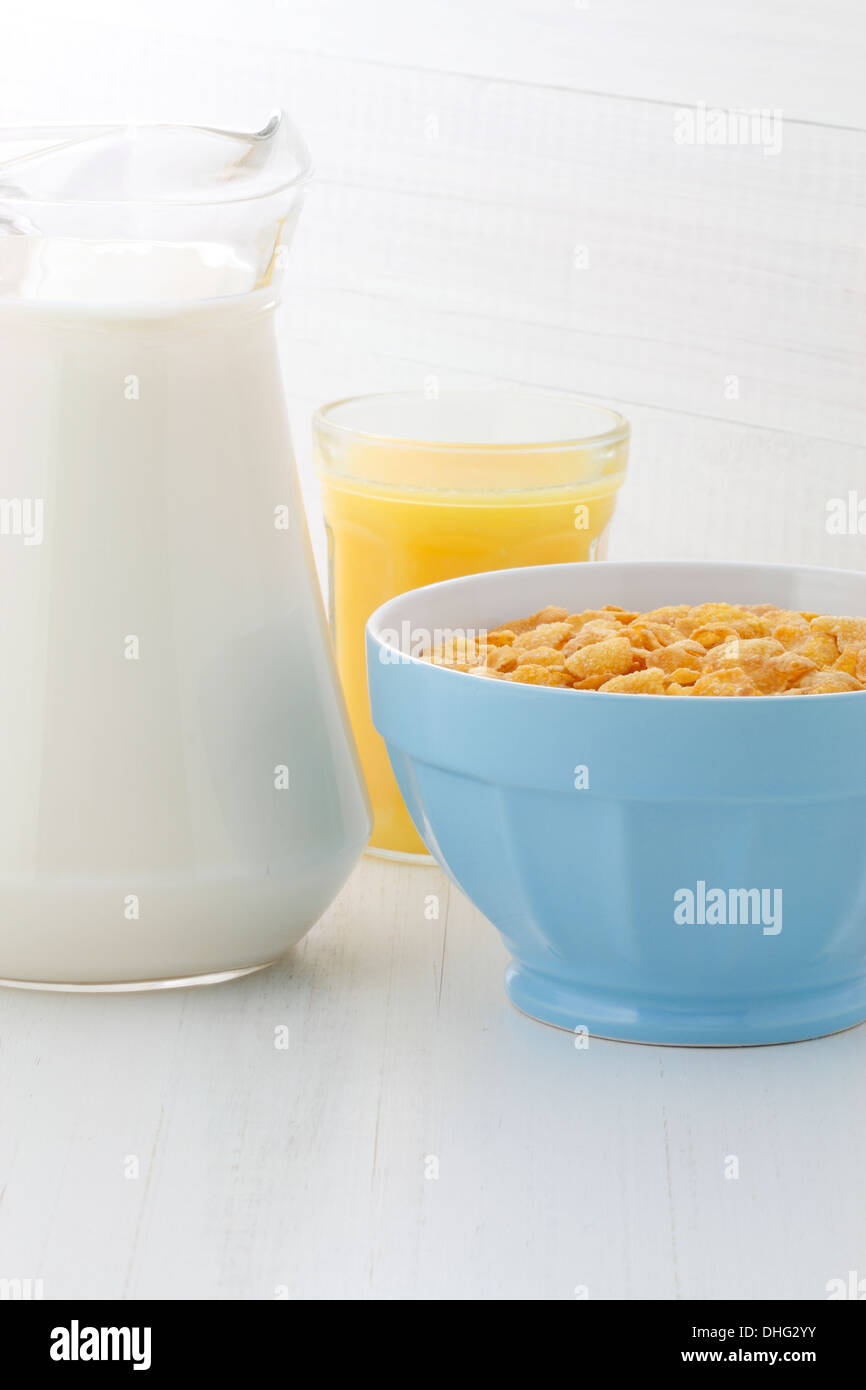 delicious and healthy corn flakes, with fresh milk and orange juice