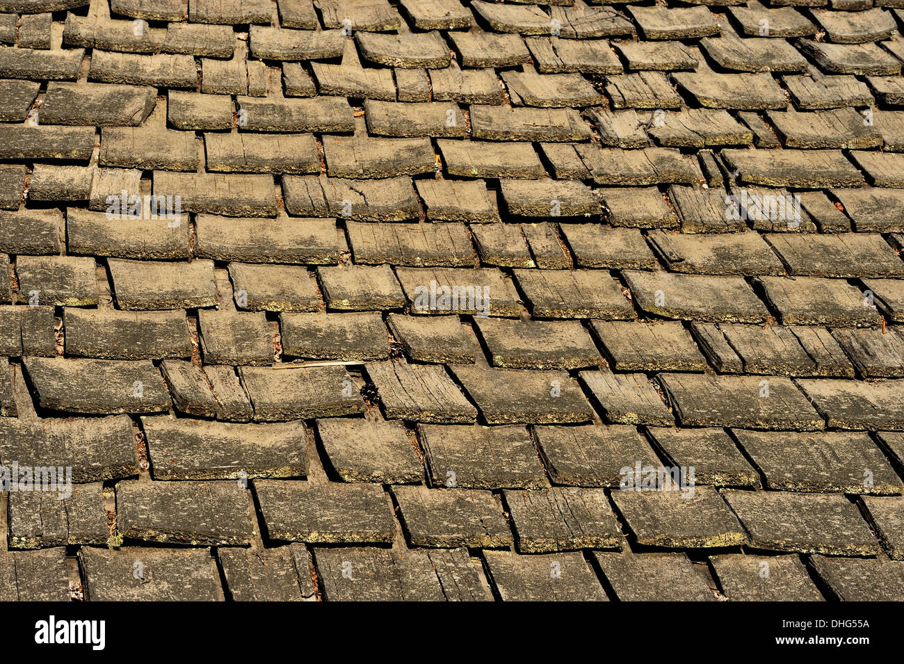 A section of a roof of a building covered with cedar shakes Stock Photo