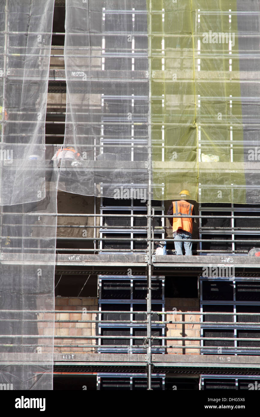 construction site workers edifice building Stock Photo - Alamy