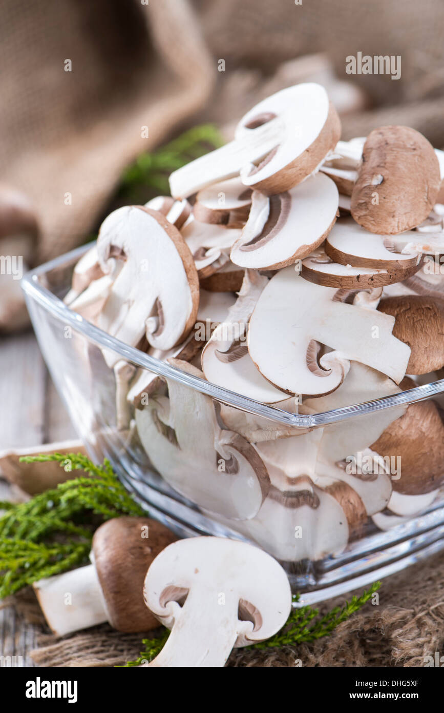 Fresh sliced Mushrooms on vintage background Stock Photo