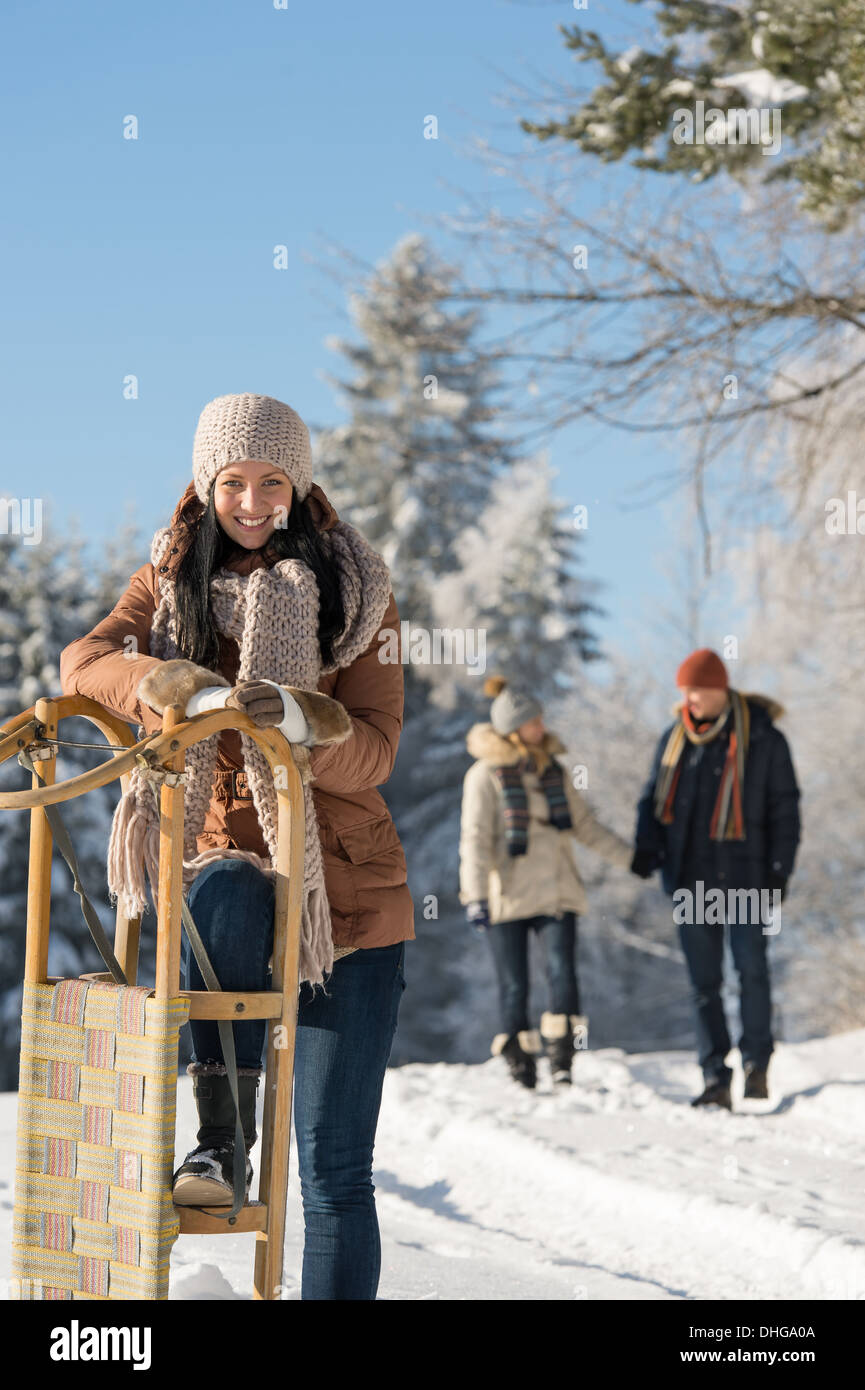 Sunny winter day people enjoy walking in snow countryside Stock Photo