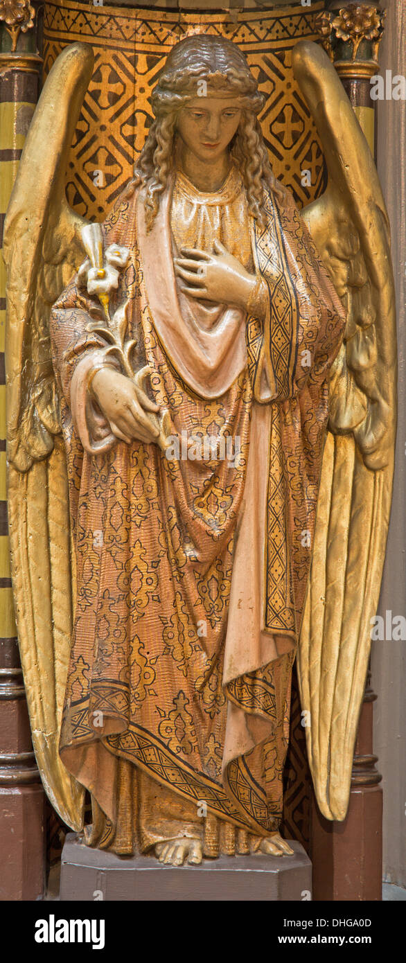 ANTWERP, BELGIUM - SEPTEMBER 5: Carved polychrome angel from pulpit of Joriskerk or st. George church Stock Photo