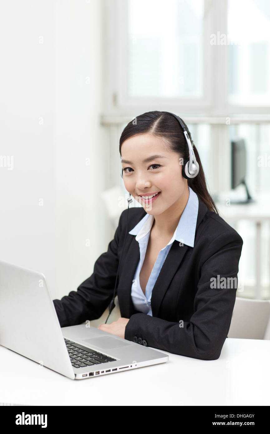 Businesswoman wearing suit sitting hi-res stock photography and images ...