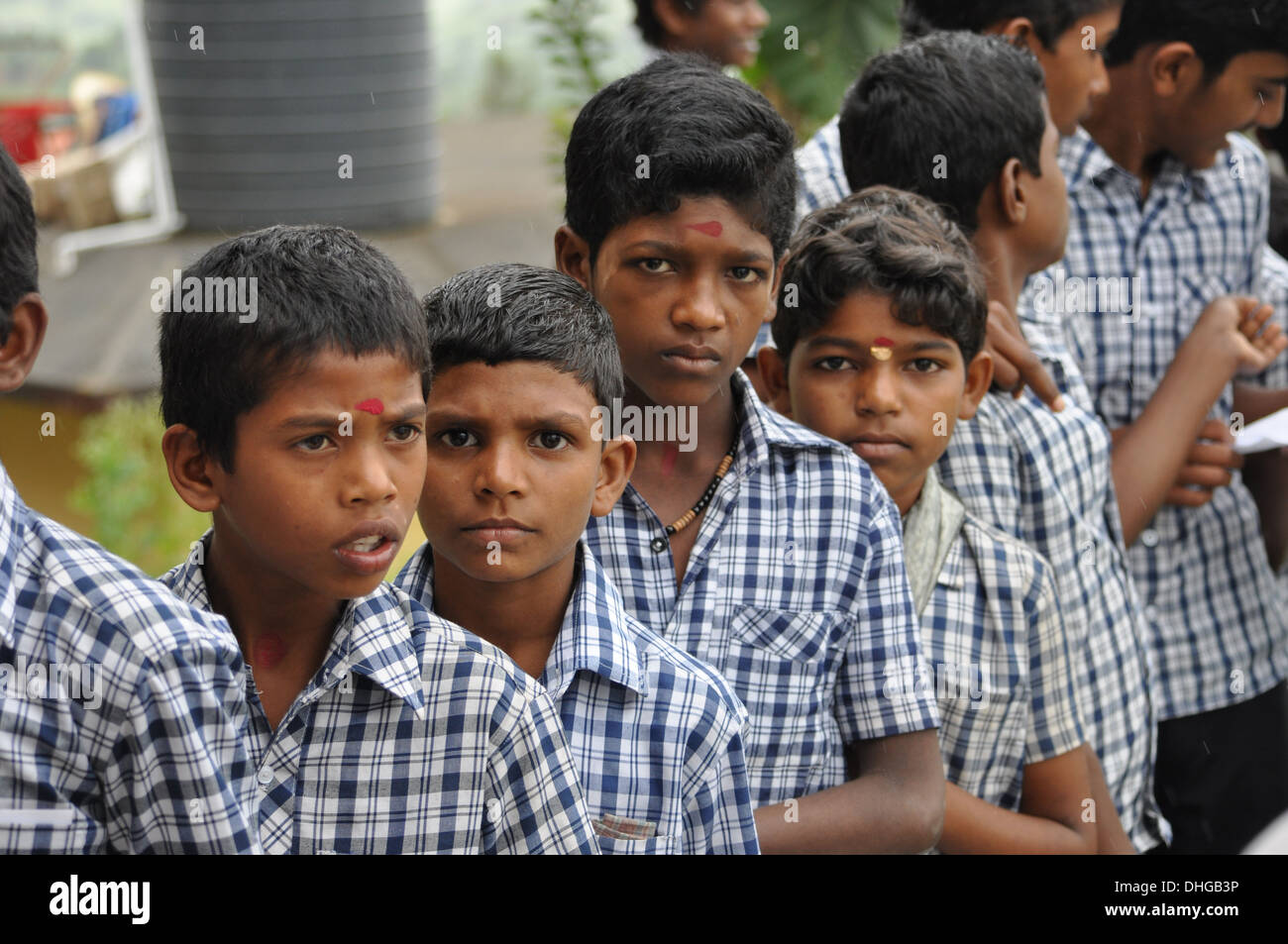 Indian village schoolboys line up in a Q for md day meals Stock Photo