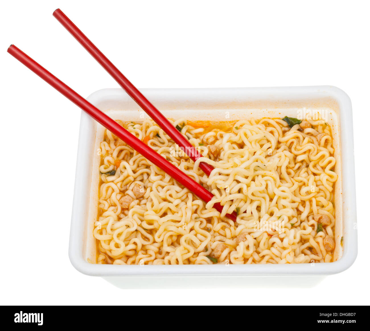 eating of cooked instant ramen by red chopsticks from foam cap isolated on white background Stock Photo