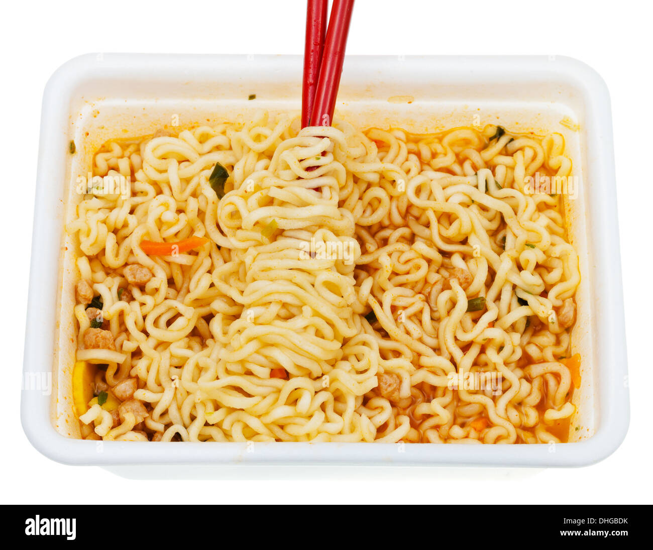 eating of instant ramen by red chopsticks from lunch box isolated on white background Stock Photo