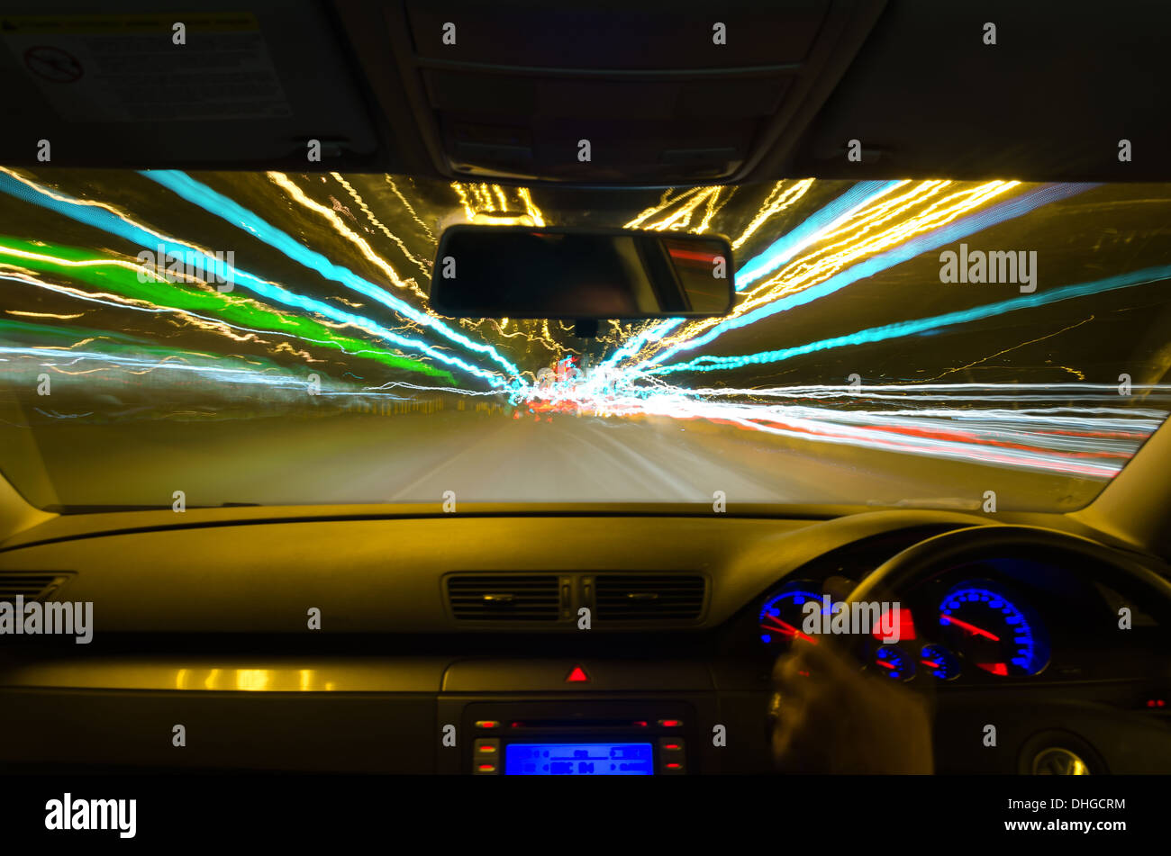 view through the windscreen of a moving car with motion blur and different sections on the motorway with road works cars lorries Stock Photo
