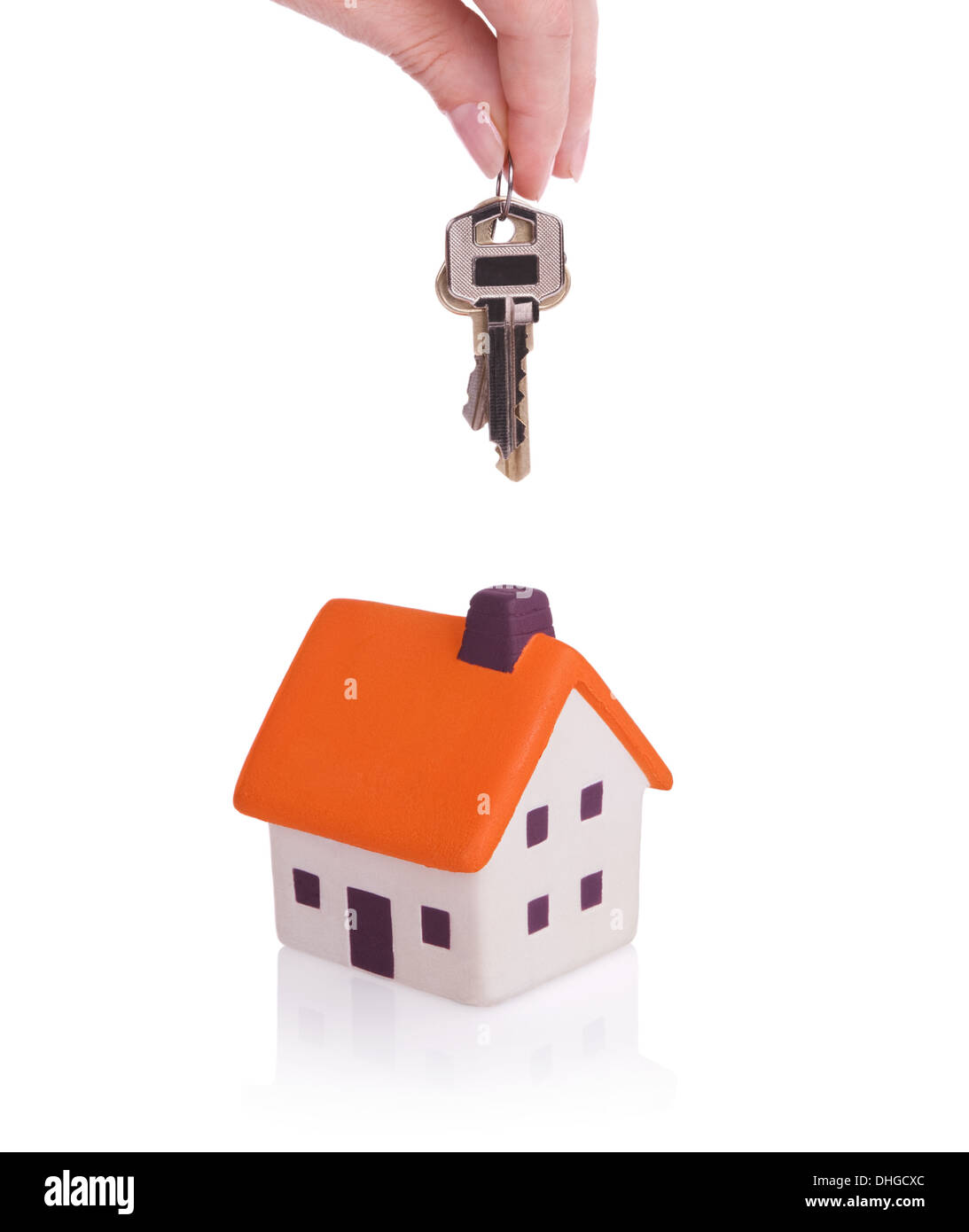 Conceptual image with small house and keys.Isolated on white Stock Photo