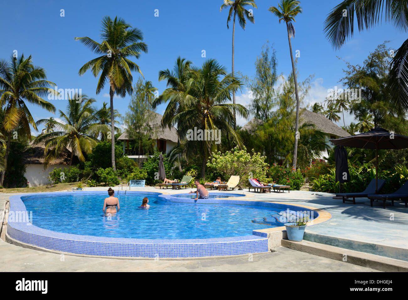 People in a swimming pool at beach side hotel, Bwejuu Beach, Indian Ocean, Zanzibar, Tanzania, East Africa Stock Photo