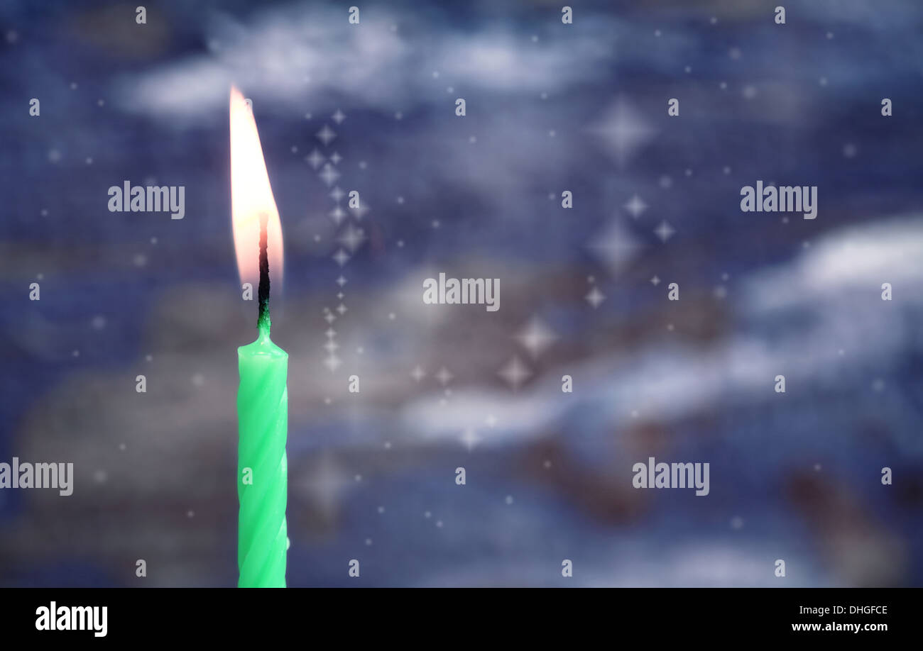 burning candle, blue background Stock Photo - Alamy