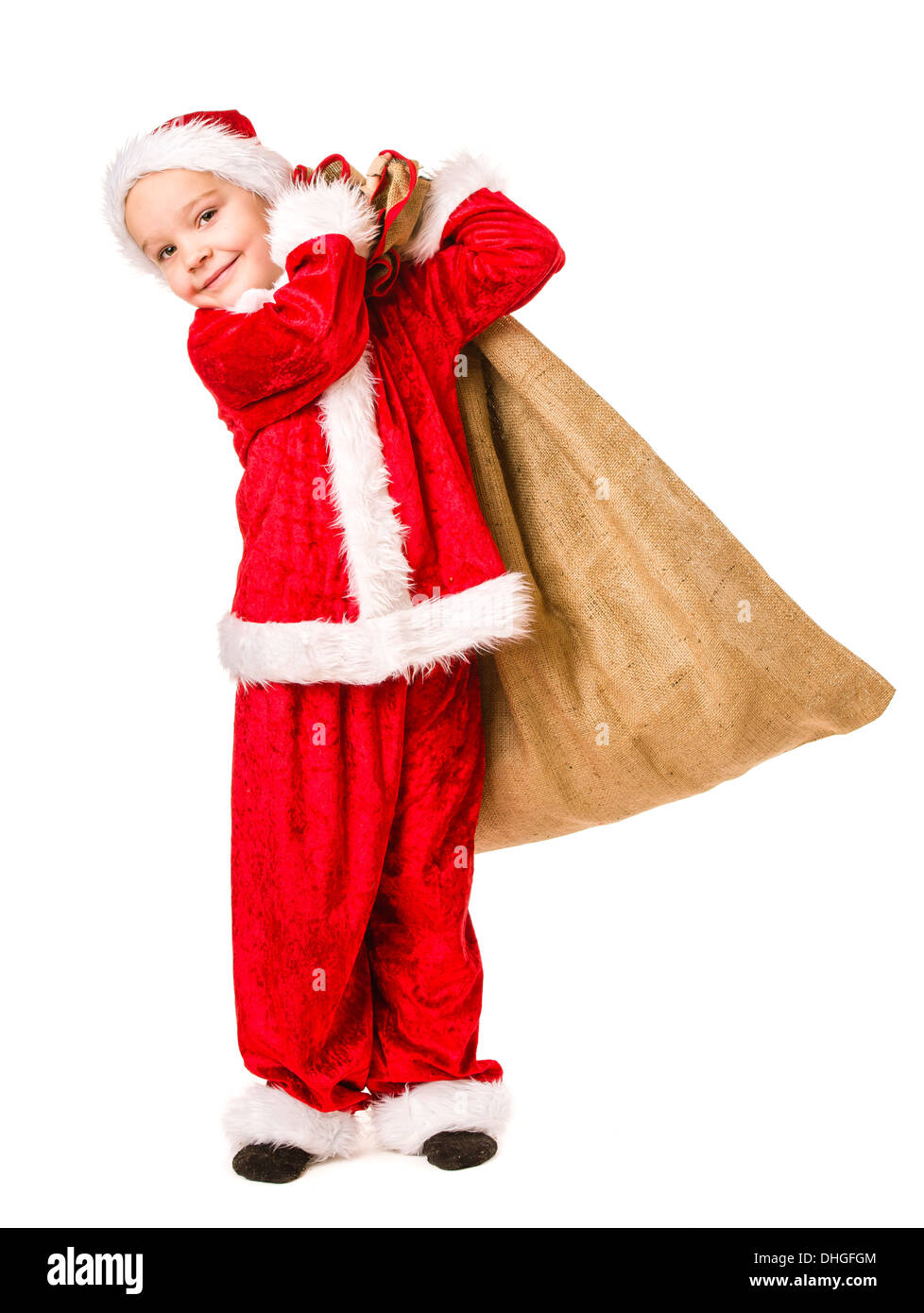 Adorable 5 year old boy wearing Santa Claus costume, Christmas sack