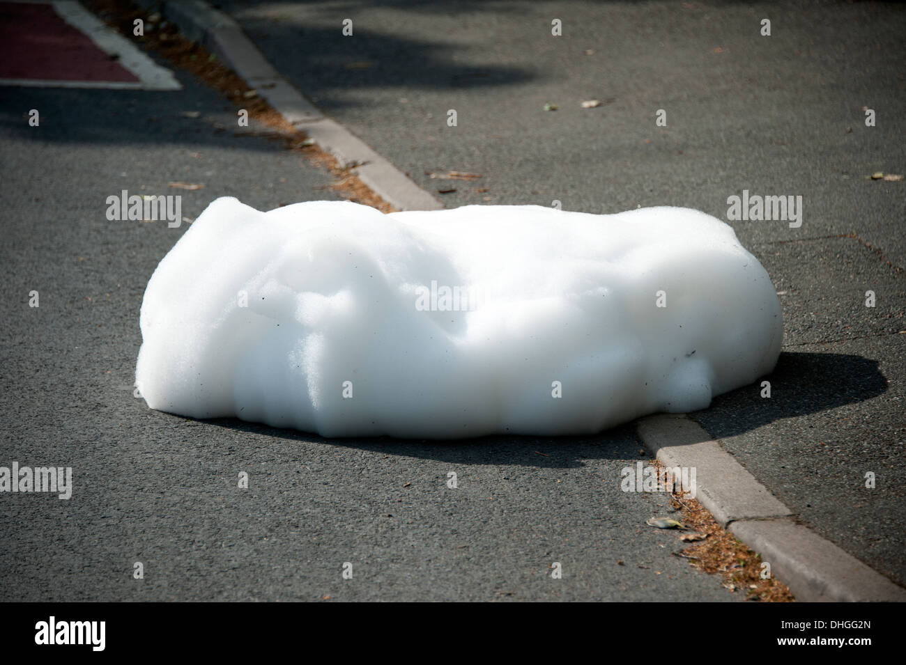 High Expansion Foam bubbling up from grid Stock Photo