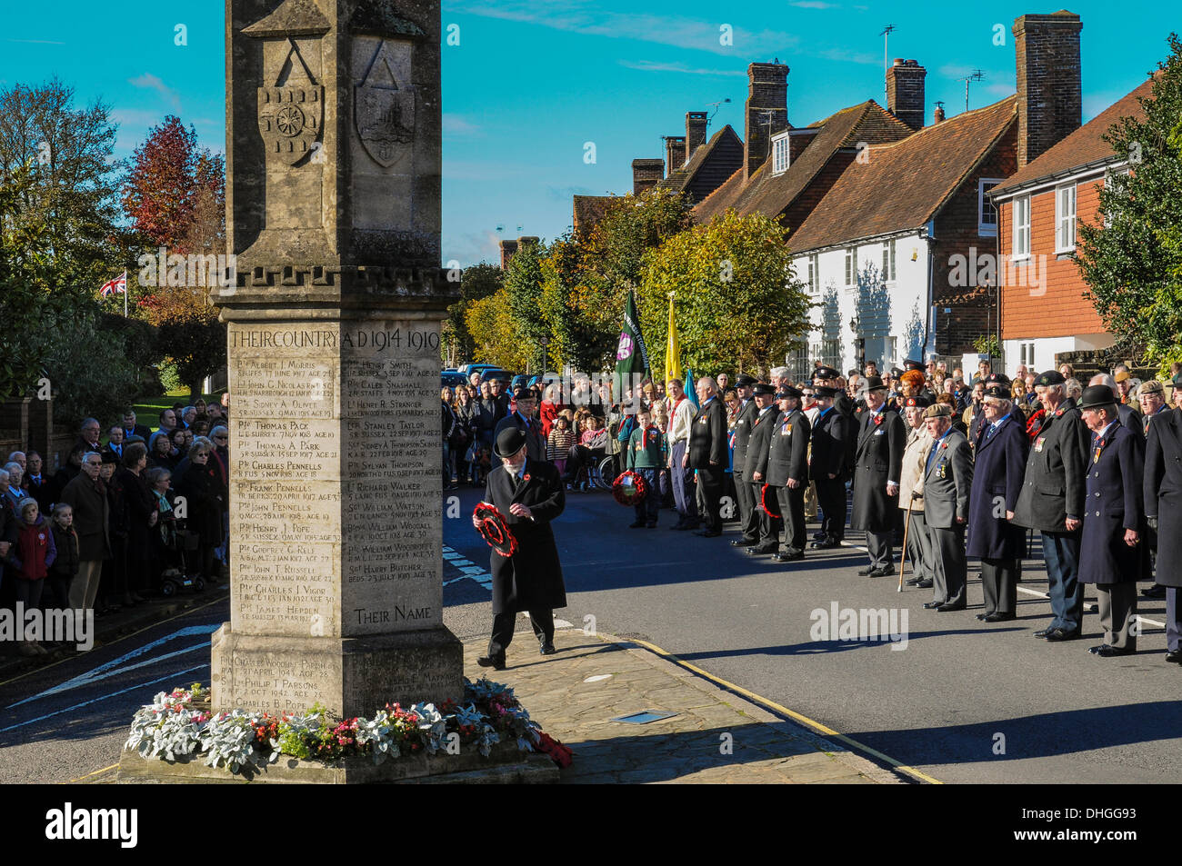 Remembrance at Burwash War Memorial in the East Sussex village Stock