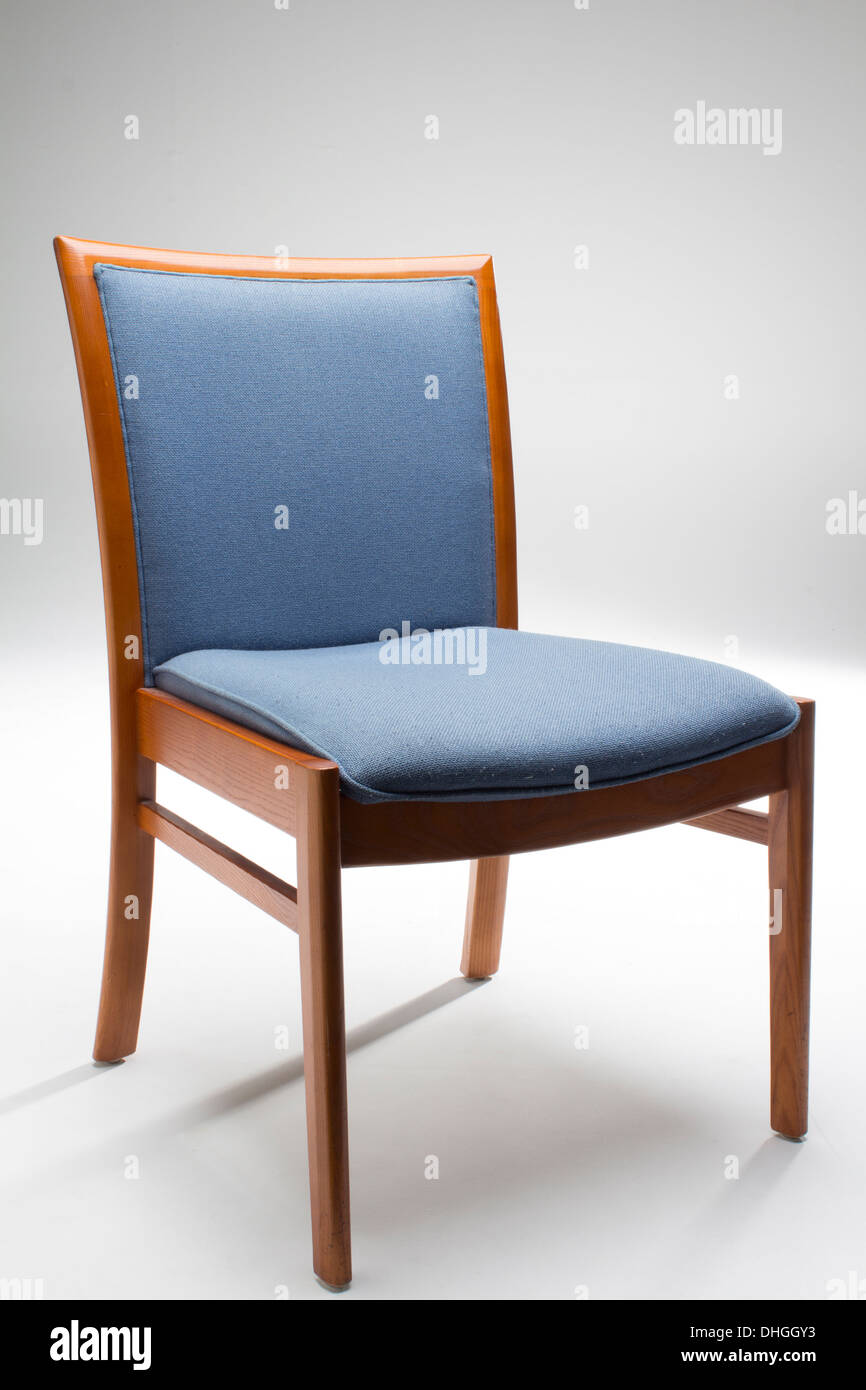 Chair, comfy, studio environment, fading background. Simplistic pack shot. Stock Photo