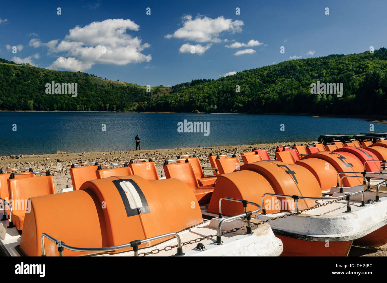 Pedal boats, Lake Pavin, a crater lake in the Auvergne region, France Stock Photo