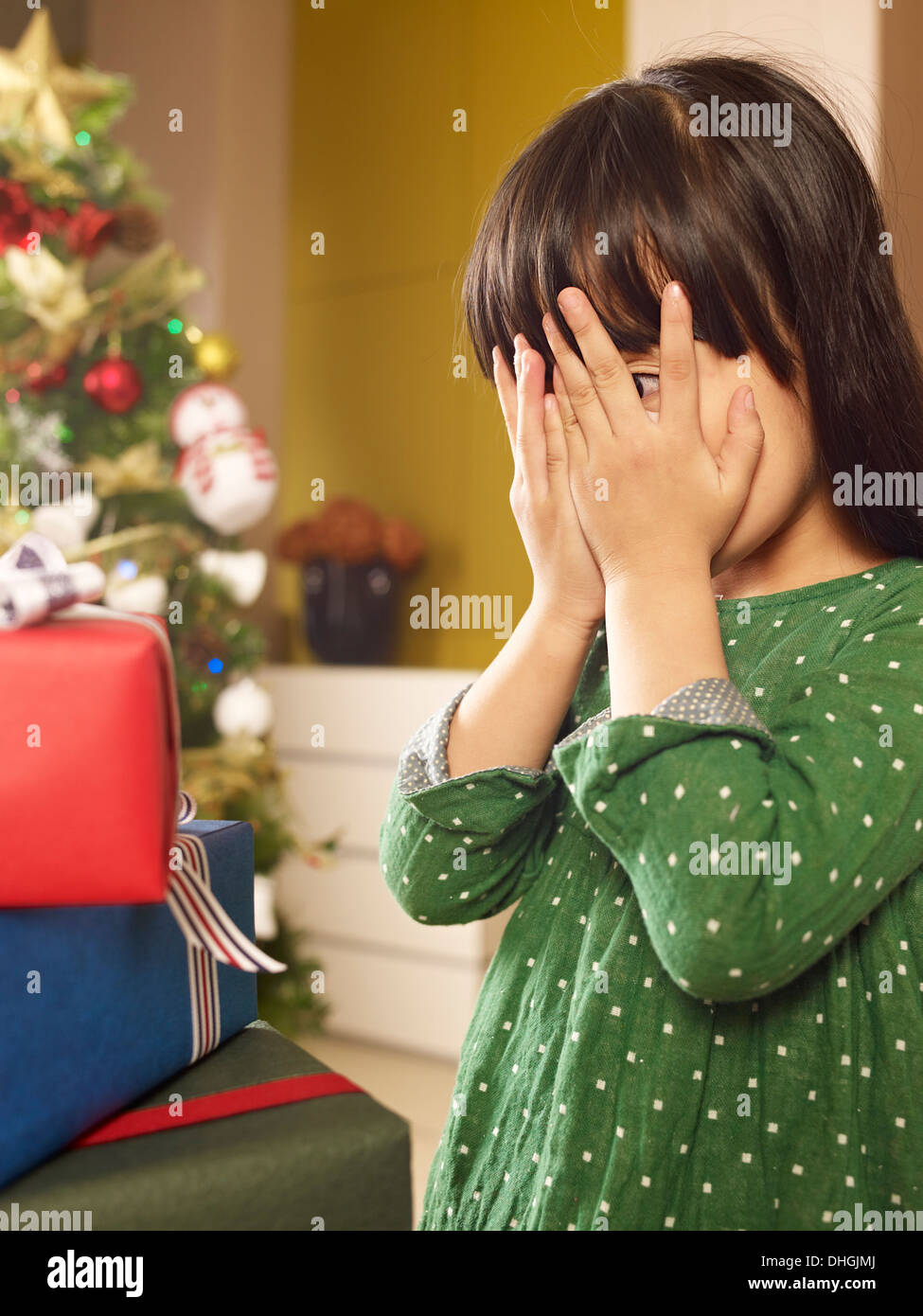 Little Asian girl and her Christmas presents Stock Photo