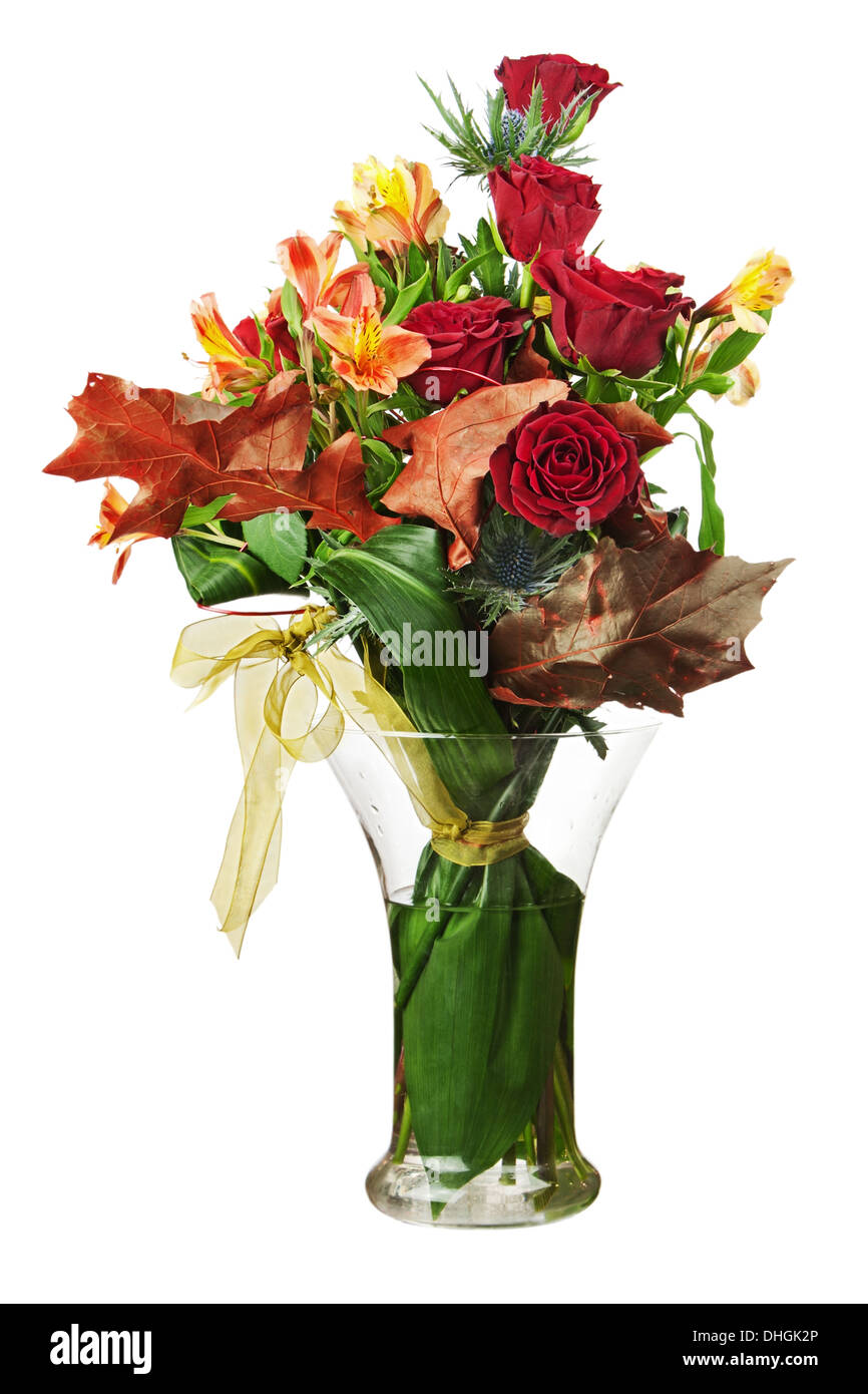 Floral bouquet of roses and lilies arrangement centerpiece in vase isolated on white background. Closeup. Stock Photo