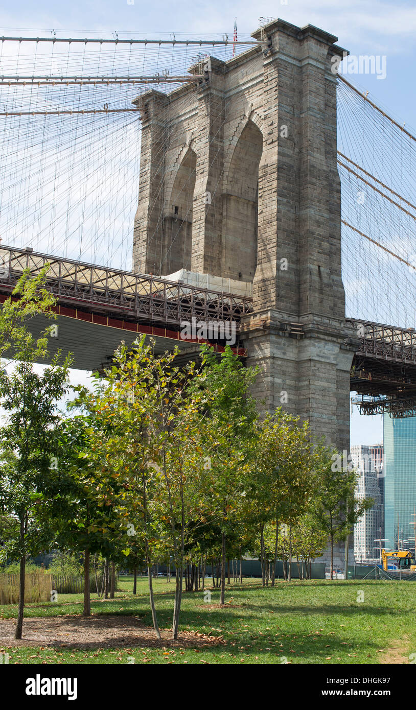 General view of the Brooklyn Bridge as seen from ground level on the Brooklyn side of the East River in New York. Stock Photo