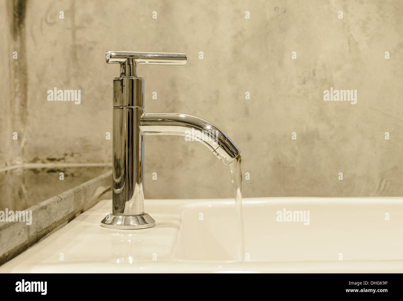 Water from faucet in bathroom boutique style. Stock Photo