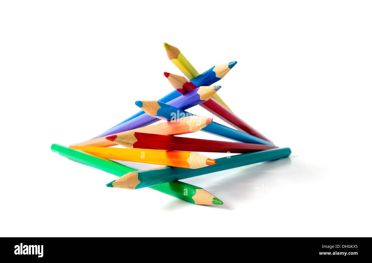 Clasped colour pencils as a hand. Conceptual photography Stock Photo