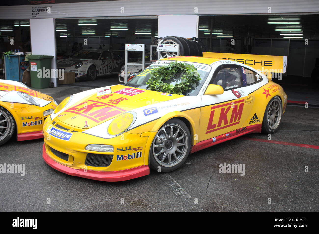 Porsche Carrera with winners wreath parked in Pit lanes at Macau Grand Prix.  Porsche Carrera Cup Asia was run on circuit this day Stock Photo