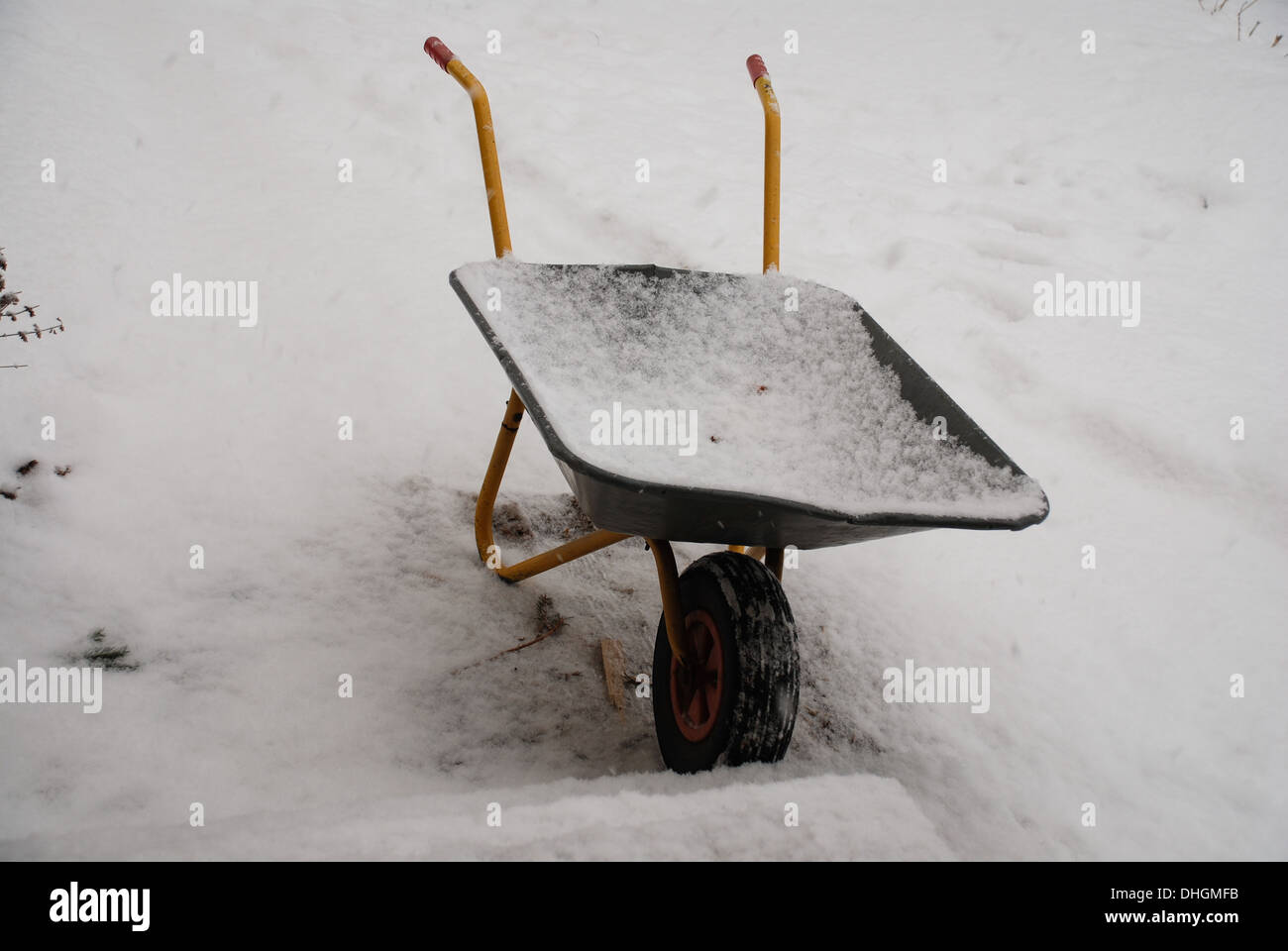 wheelbarrow in the snow Stock Photo