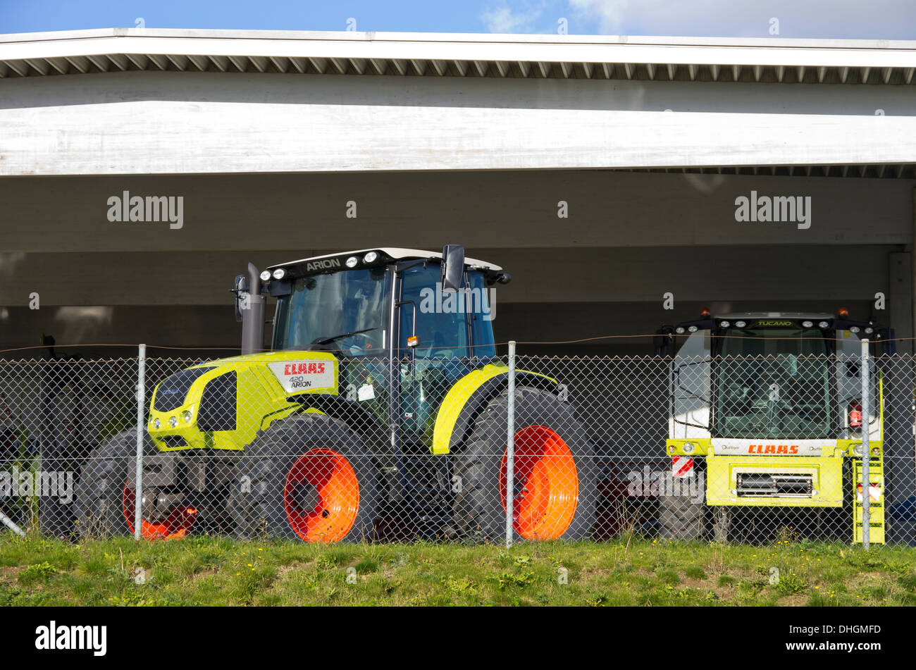 Tractor And Combine Harvester Behind Fence Stock Photo Alamy