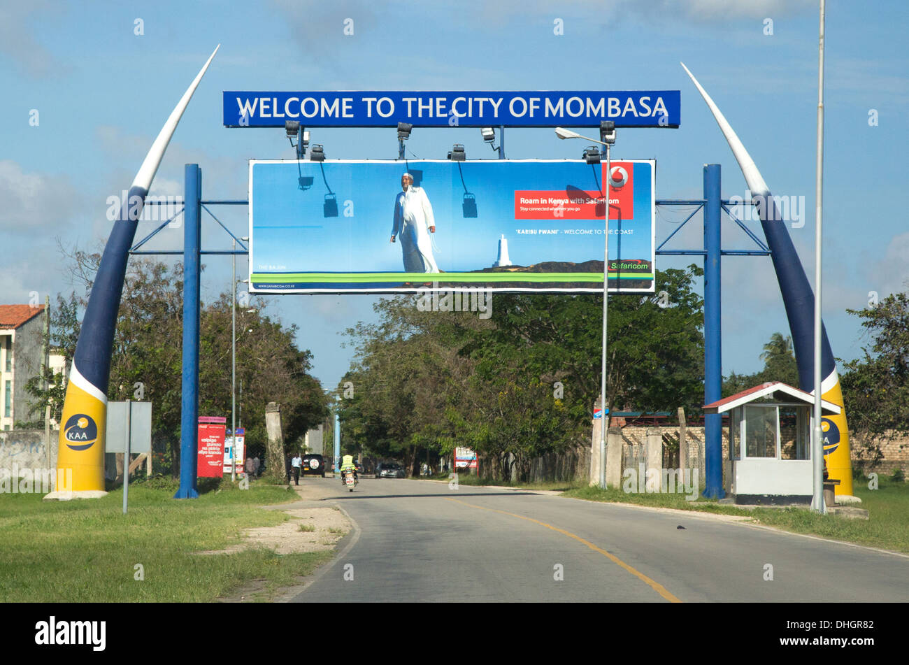 Sign in the form of two gigantic elephant tusks welcoming travellers leaving Momabasa airport Kenya Africa Stock Photo