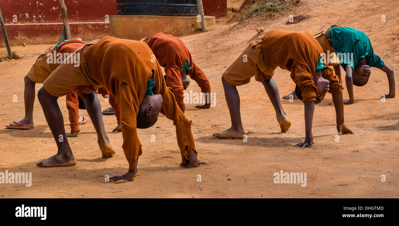 Schoolboys performing an acrobatic display in a Kenyan primary school Stock Photo