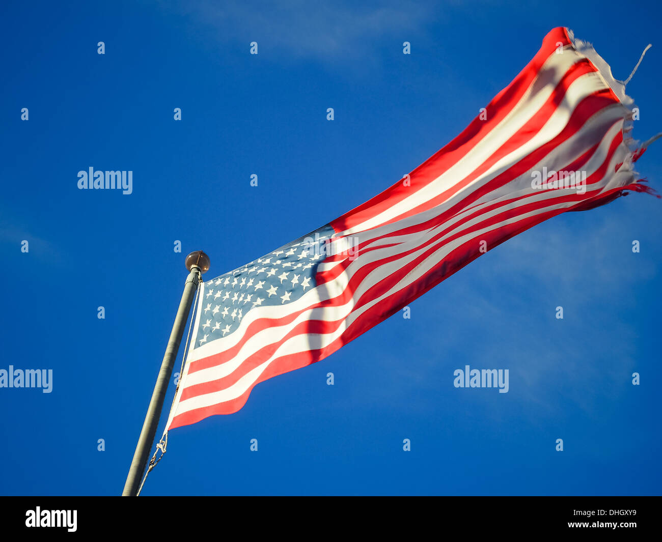 flag of the United States of America flying at the top of a flag pole ...