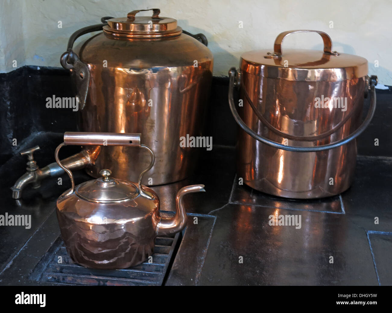 Copper wear in the kitchens at Dunham Massey NT property Cheshire England UK Stock Photo