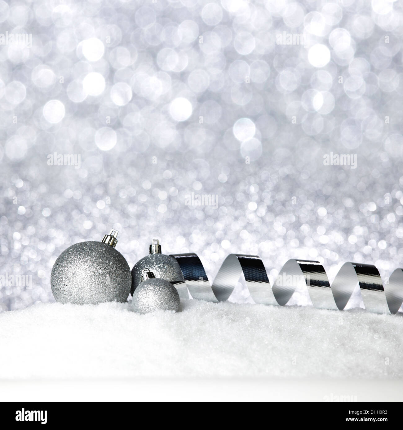 Christmas balls and ribbons on snow Stock Photo - Alamy