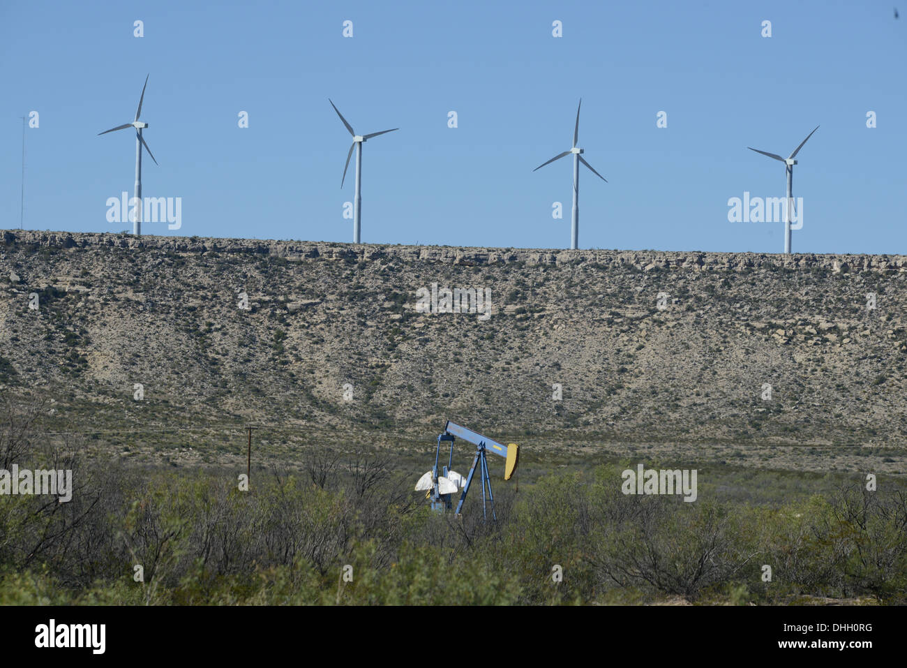 Wind farm with an oil pumping jack shows 2 types of modern day energy